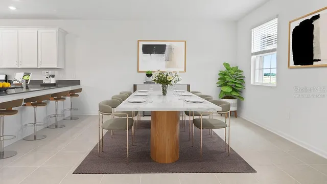 a view of a dining room with furniture and window