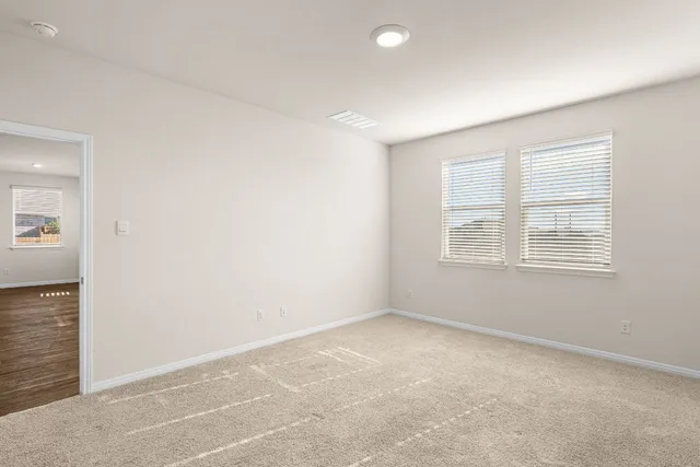 an empty room with windows