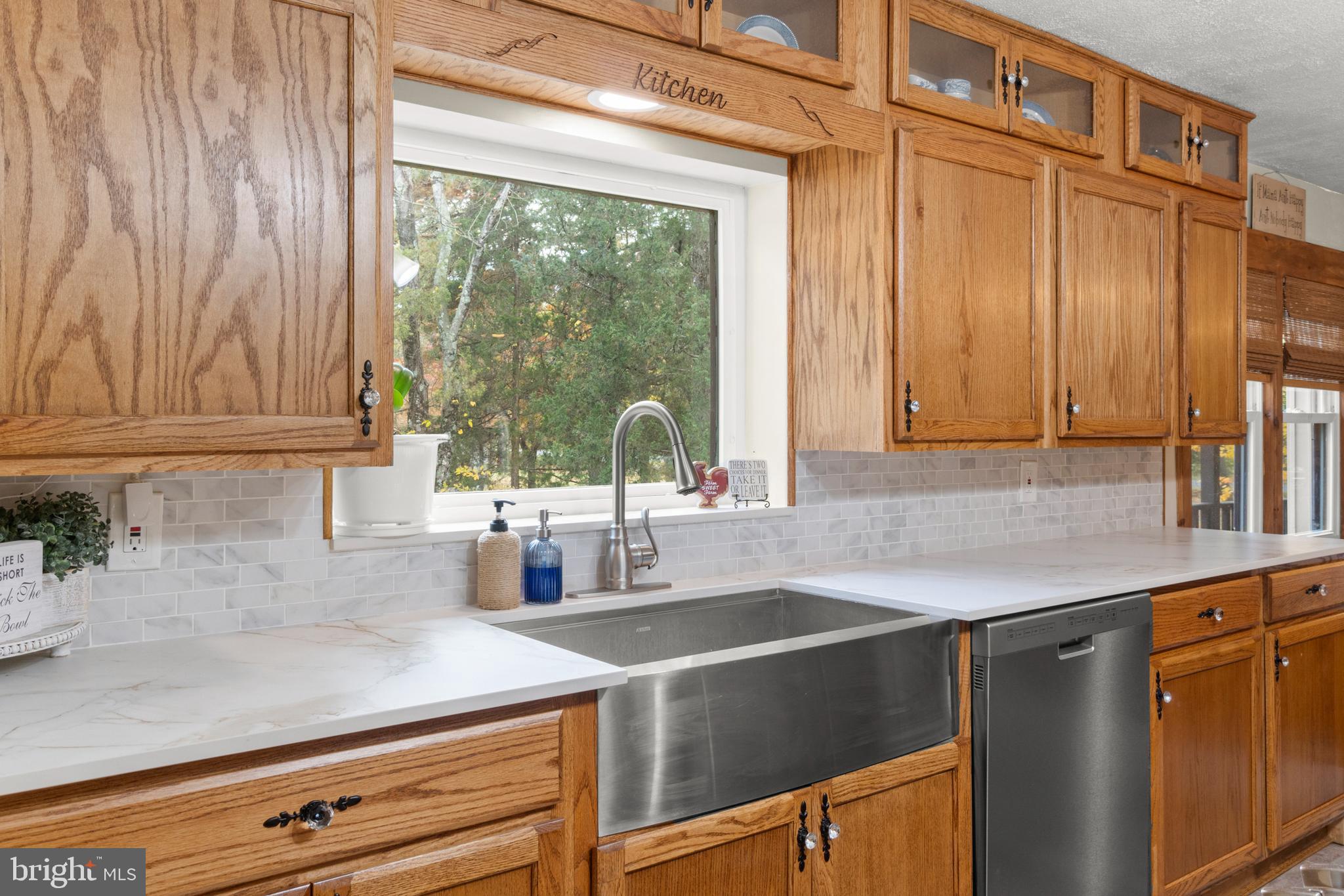 108 New Brooklyn Road Sicklerville, NJ 08081 - Photo 14 of 25 a kitchen with stainless steel appliances granite countertop a sink a stove and a wooden cabinets