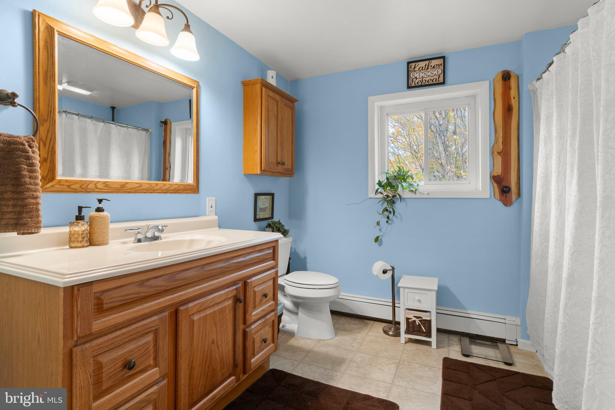 108 New Brooklyn Road Sicklerville, NJ 08081 - Photo 18 of 25 a bathroom with a sink a toilet and mirror