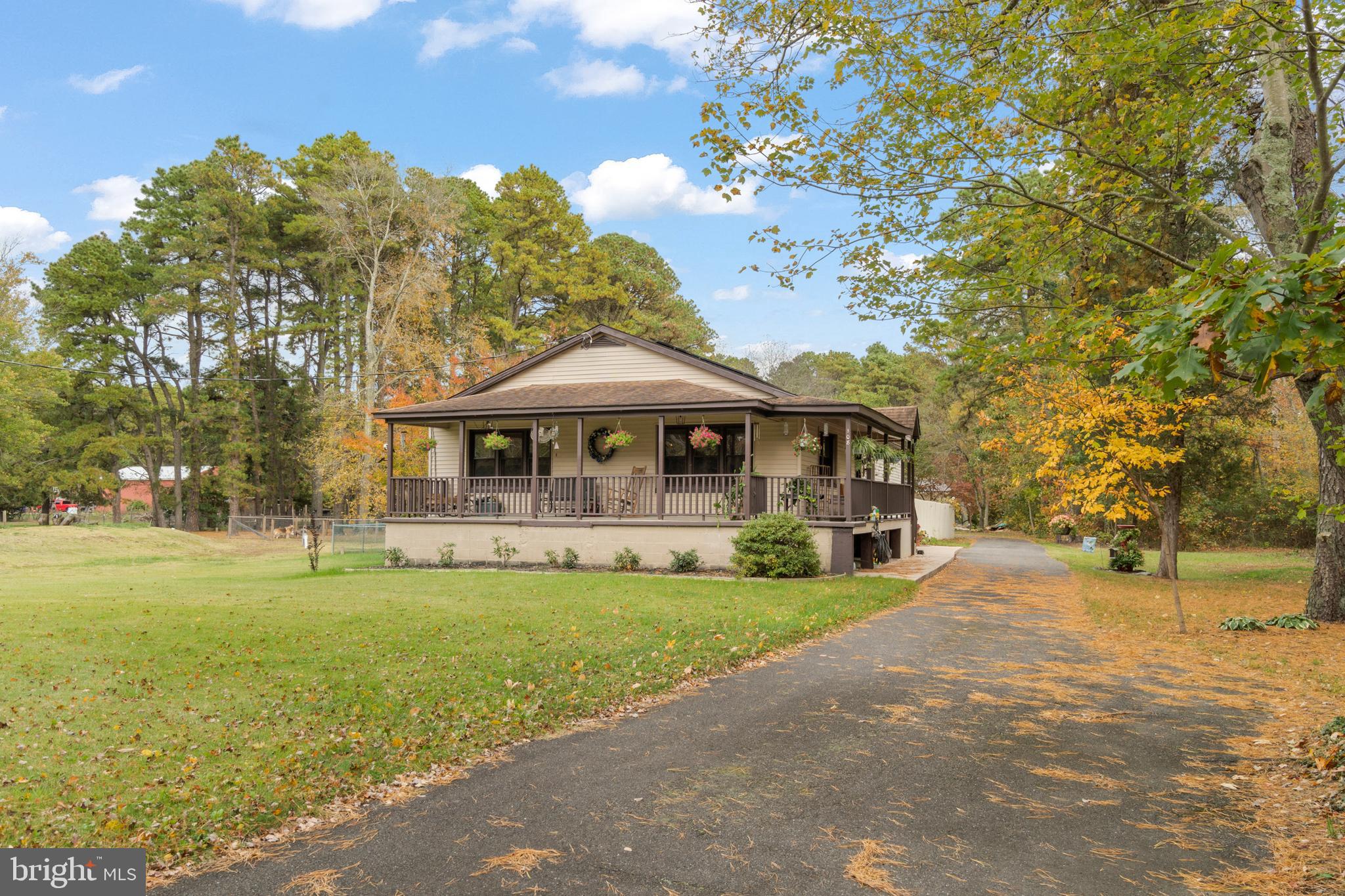 108 New Brooklyn Road Sicklerville, NJ 08081 - Photo 2 of 25 a front view of a house with a garden