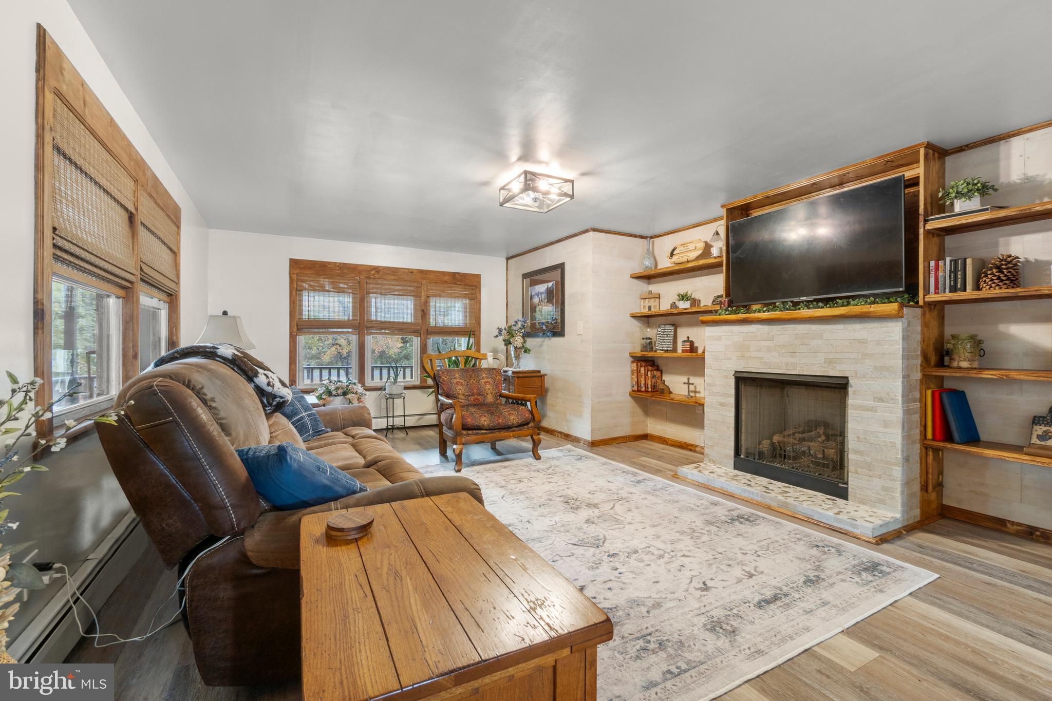 108 New Brooklyn Road Sicklerville, NJ 08081 - Photo 6 of 25 a living room with furniture and a fireplace