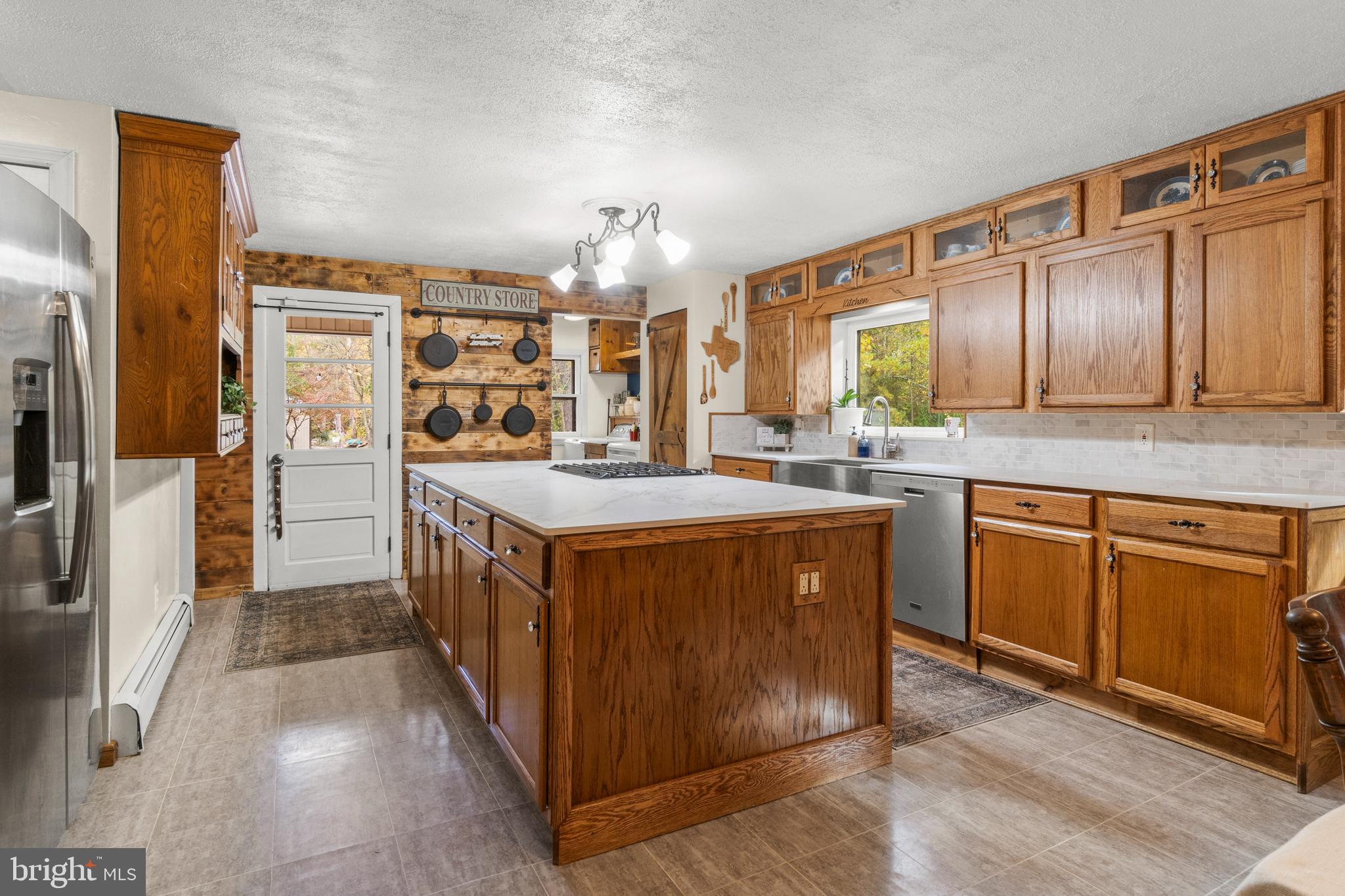 108 New Brooklyn Road Sicklerville, NJ 08081 - Photo 9 of 25 a kitchen with stainless steel appliances granite countertop a sink and cabinets