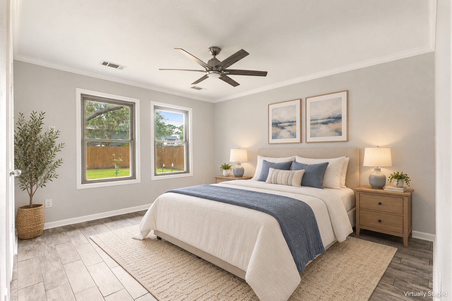 6123 Springhaven Drive Houston, TX 77396 - Photo 17 of 36 Primary bedroom features two windows, wood-look tile flooring and a ceiling fan. Virtually Staged