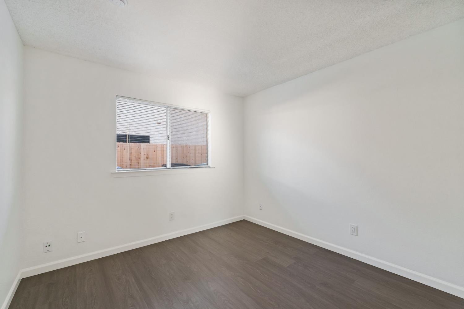 9342 North Archie Avenue Fresno, CA 93720 - Photo 16 of 36 an empty room with a workbench