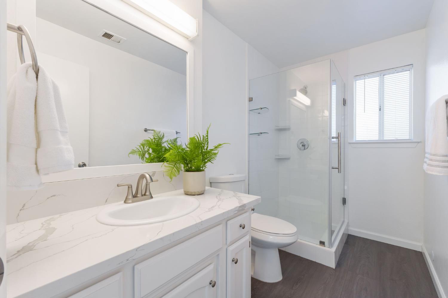 9342 North Archie Avenue Fresno, CA 93720 - Photo 17 of 36 a bathroom with a sink a toilet and shower