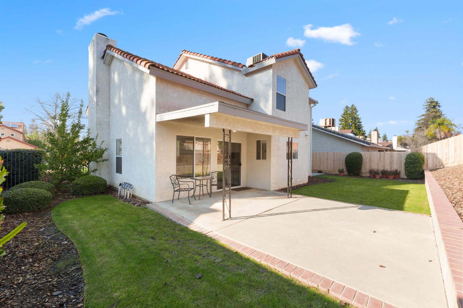 9342 North Archie Avenue Fresno, CA 93720 - Photo 32 of 36 a view of house with a yard