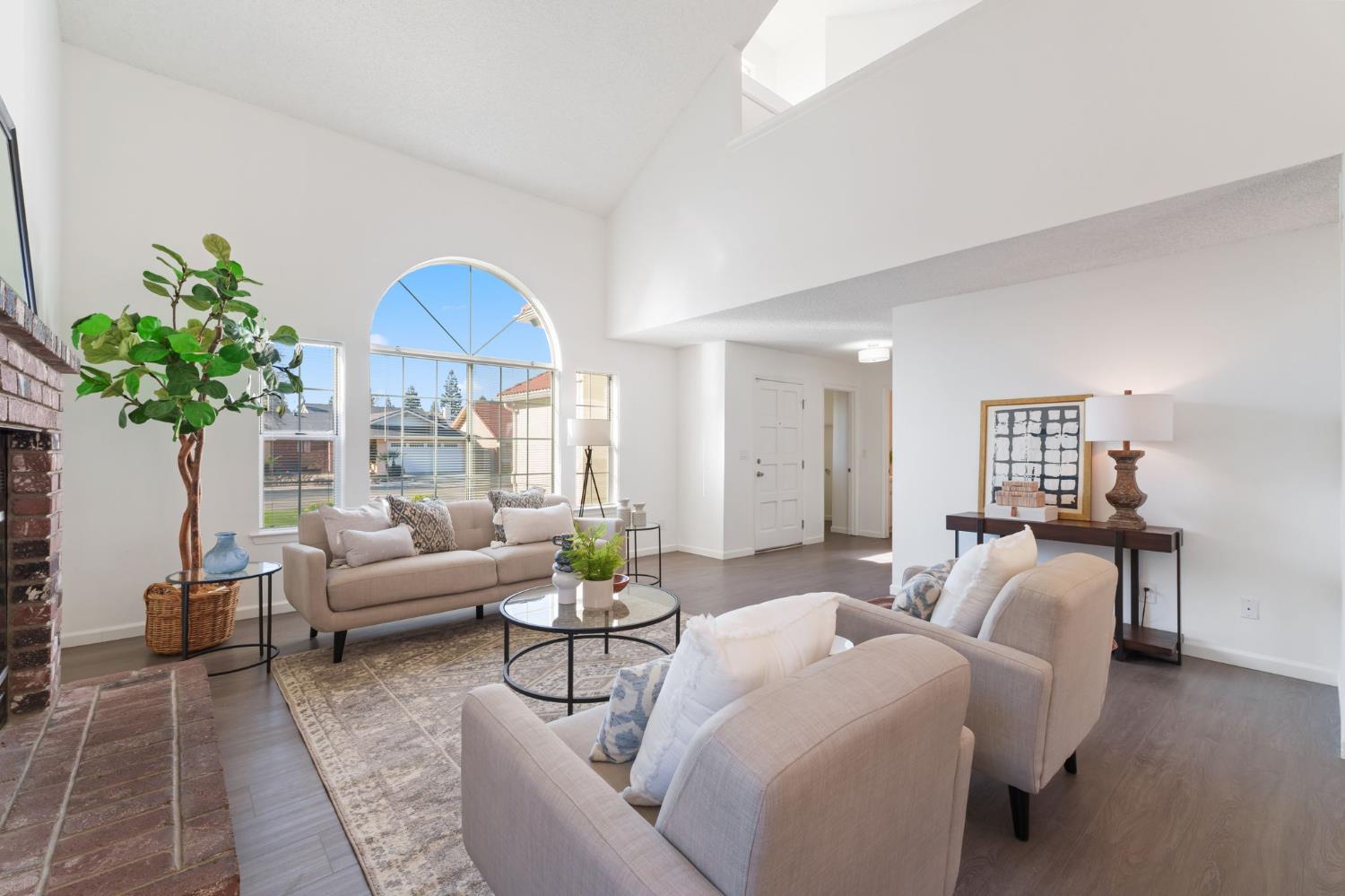 9342 North Archie Avenue Fresno, CA 93720 - Photo 6 of 36 a living room with furniture and a potted plant