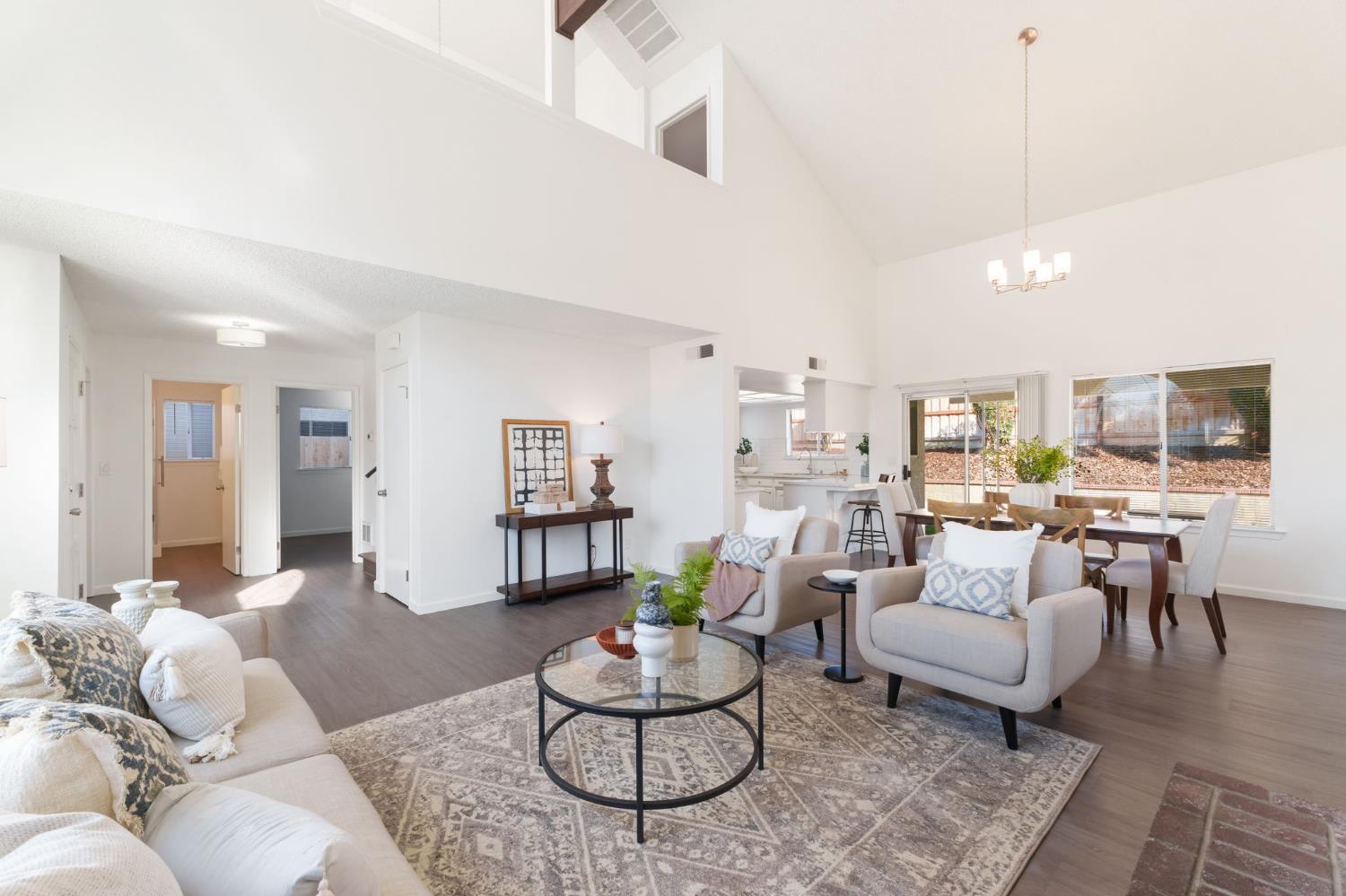9342 North Archie Avenue Fresno, CA 93720 - Photo 7 of 36 a living room with furniture and a large window