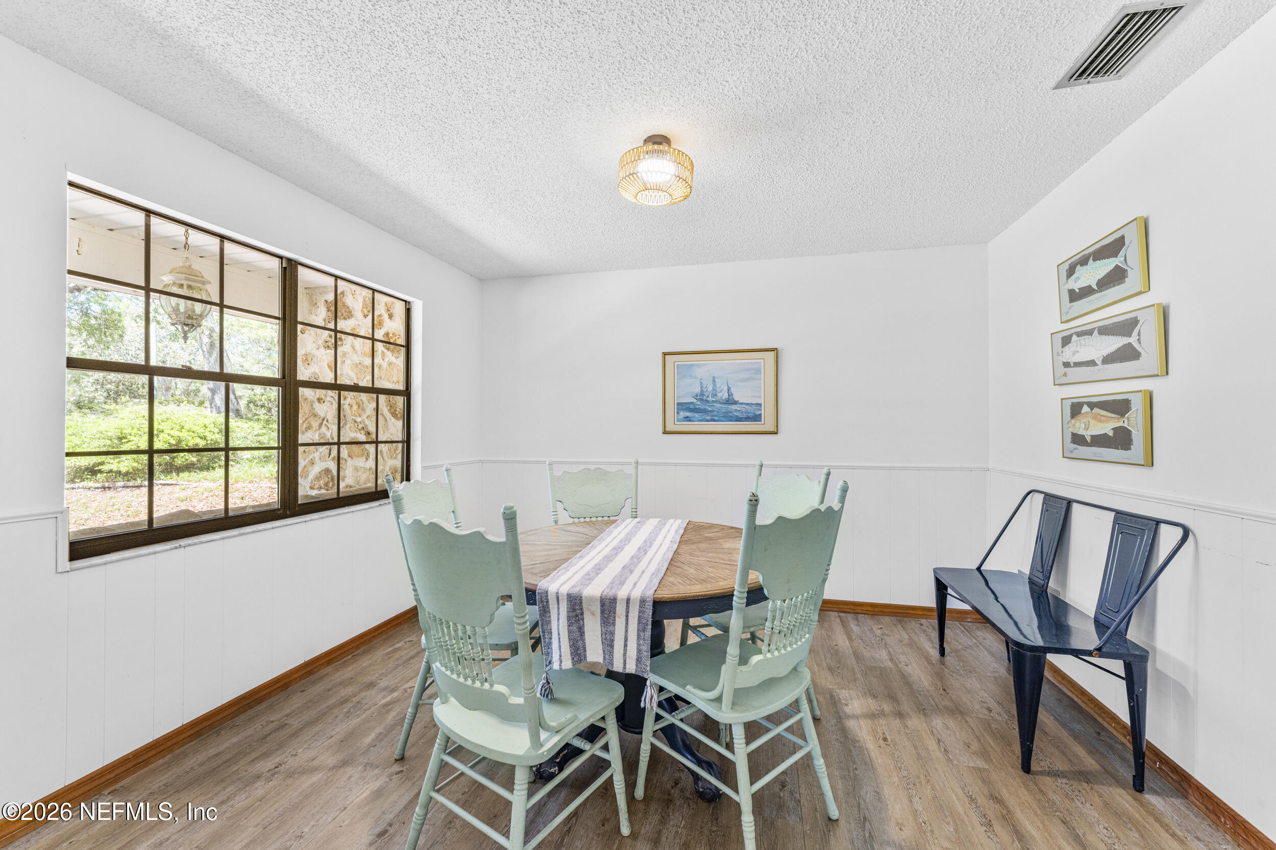 701 16th Street St. Augustine, FL 32080 - Photo 11 of 39 a view of a dining room with furniture and a window