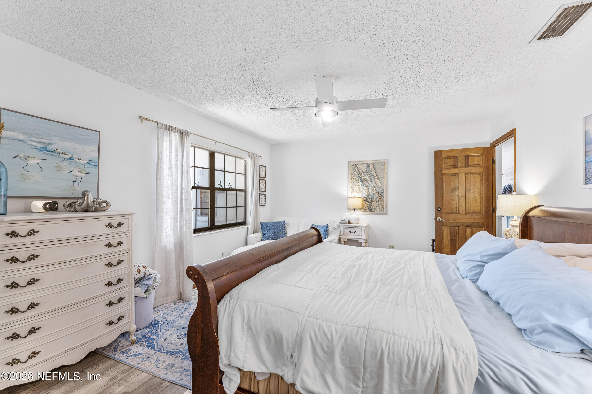 701 16th Street St. Augustine, FL 32080 - Photo 16 of 39 a bedroom with a bed and a dresser