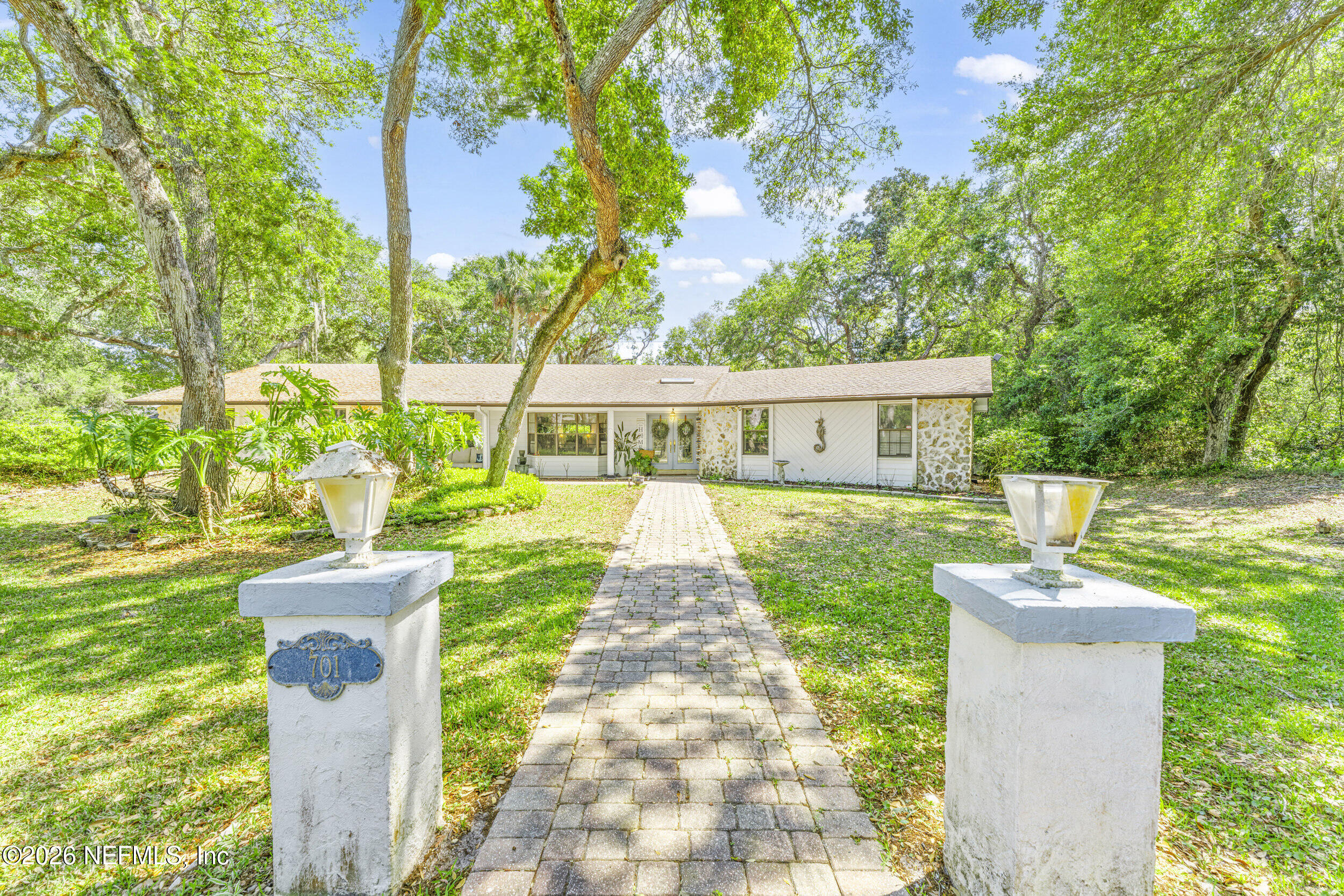 701 16th Street St. Augustine, FL 32080 - Photo 2 of 39 a view of a house with garden and a trees