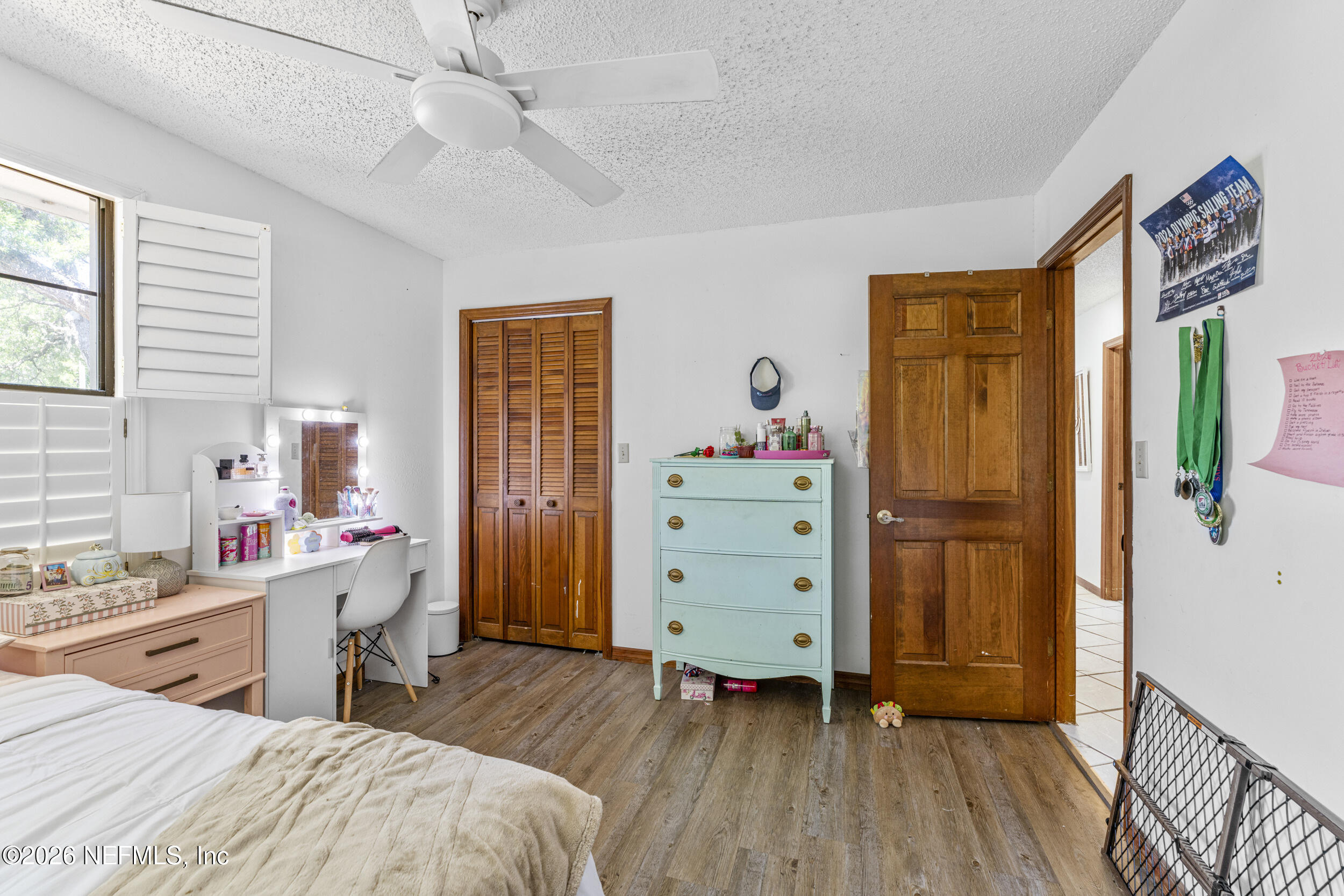 701 16th Street St. Augustine, FL 32080 - Photo 23 of 39 a room with a baby bed baby crib and furniture