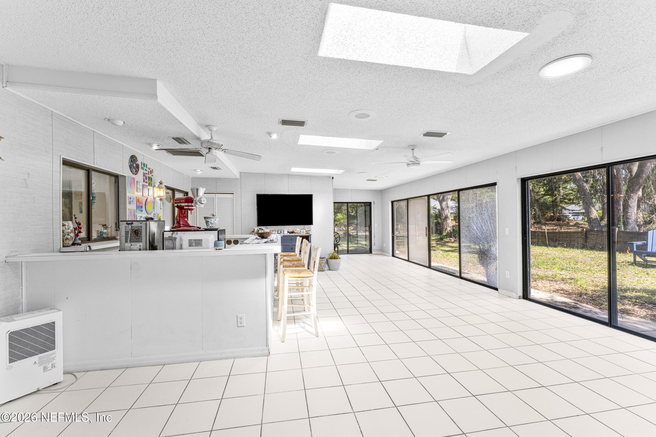 701 16th Street St. Augustine, FL 32080 - Photo 29 of 39 a view of a kitchen with furniture and large windows