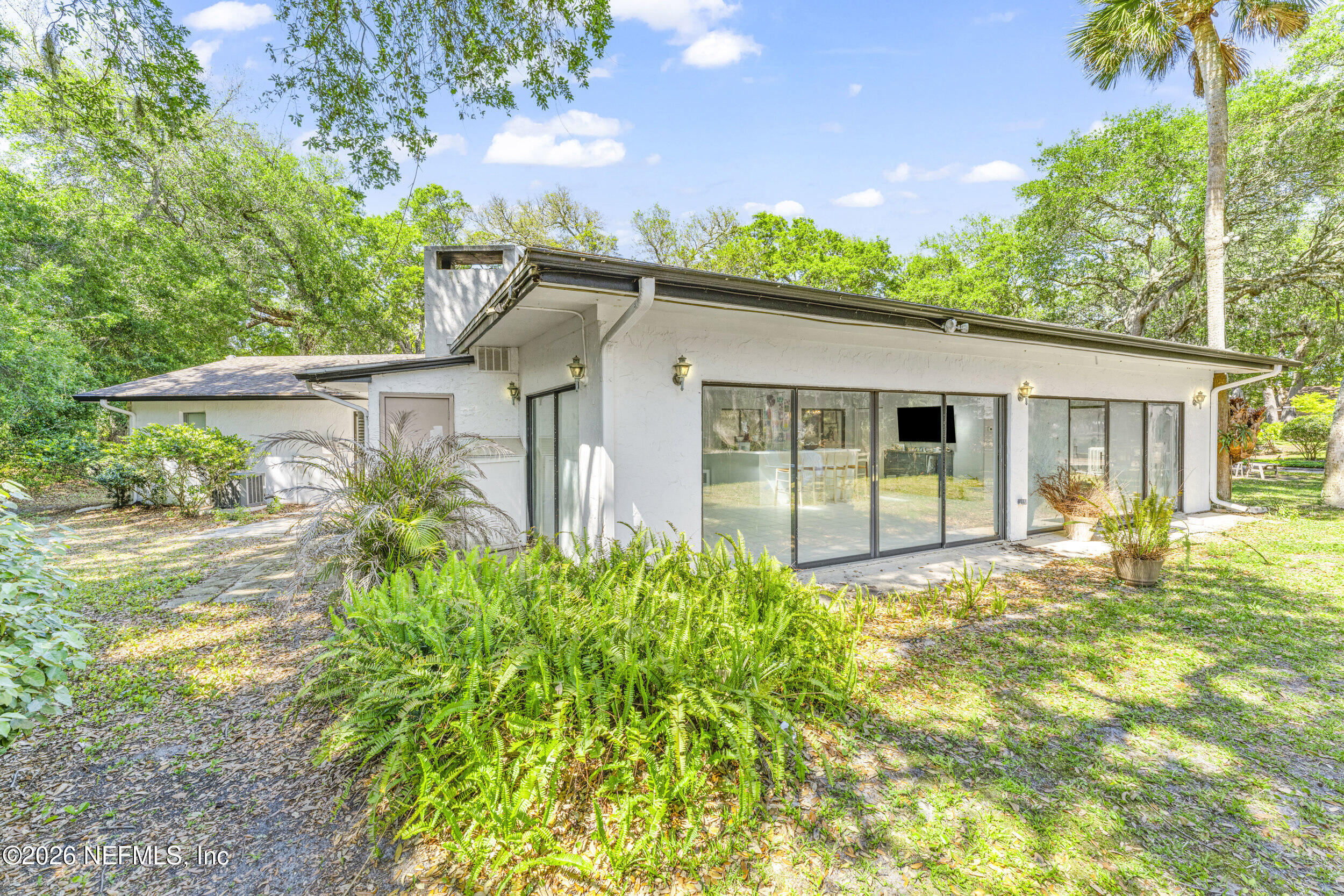 701 16th Street St. Augustine, FL 32080 - Photo 31 of 39 a house view with a garden space