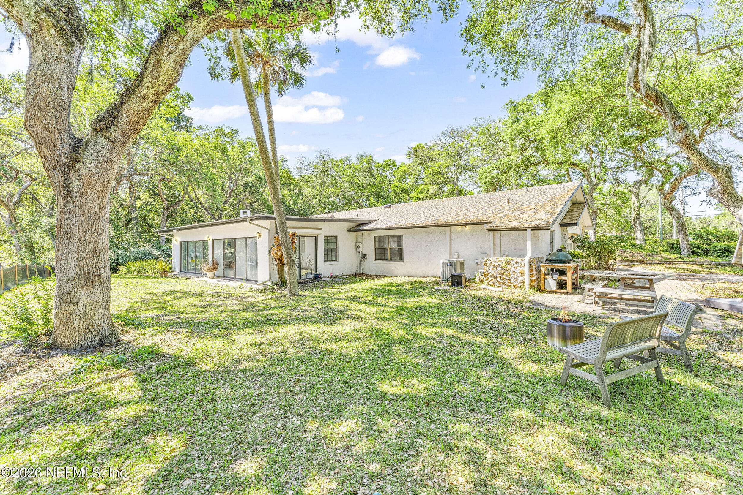 701 16th Street St. Augustine, FL 32080 - Photo 33 of 39 a view of a house with backyard and sitting area