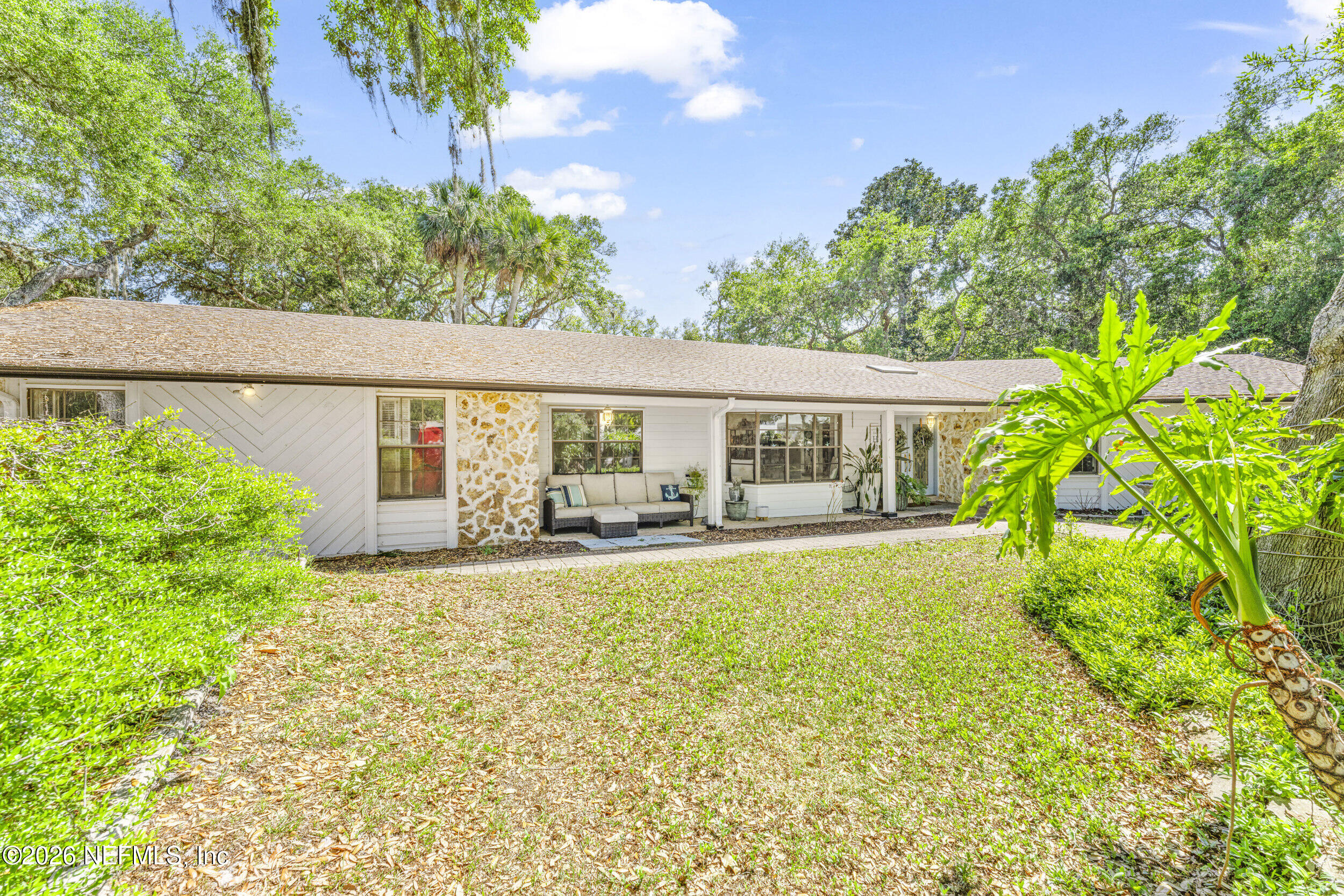 701 16th Street St. Augustine, FL 32080 - Photo 36 of 39 a front view of house with yard and green space