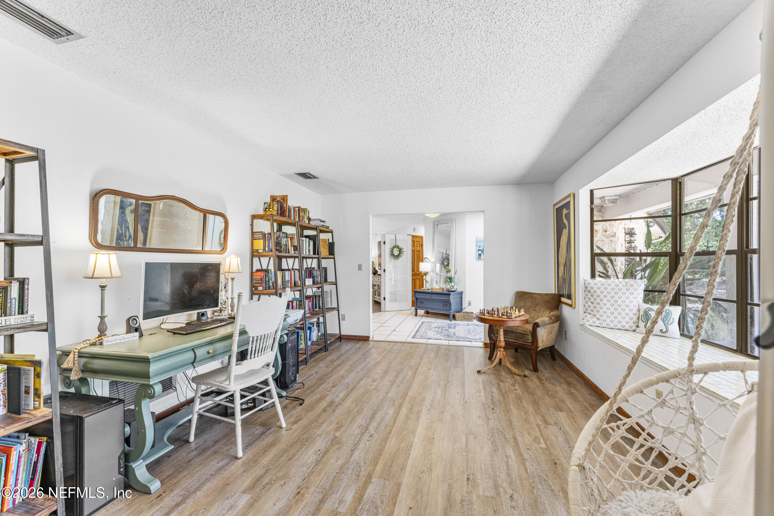 701 16th Street St. Augustine, FL 32080 - Photo 9 of 39 a living room with furniture and a wooden floor