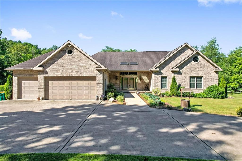 216 Marshall Road Oakdale, PA 15071 - Photo 25 of 25 a front view of a house with a yard and garage