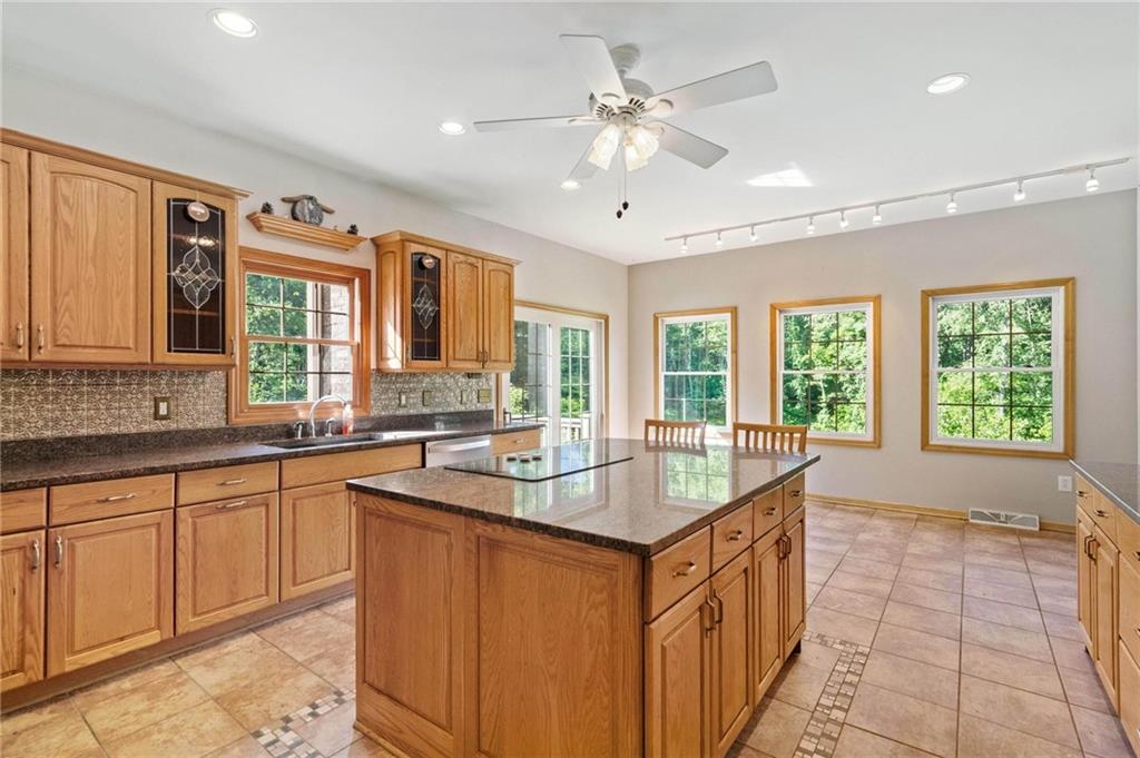216 Marshall Road Oakdale, PA 15071 - Photo 8 of 25 a dining hall with stainless steel appliances granite countertop a sink and dishwasher with a large kitchen island