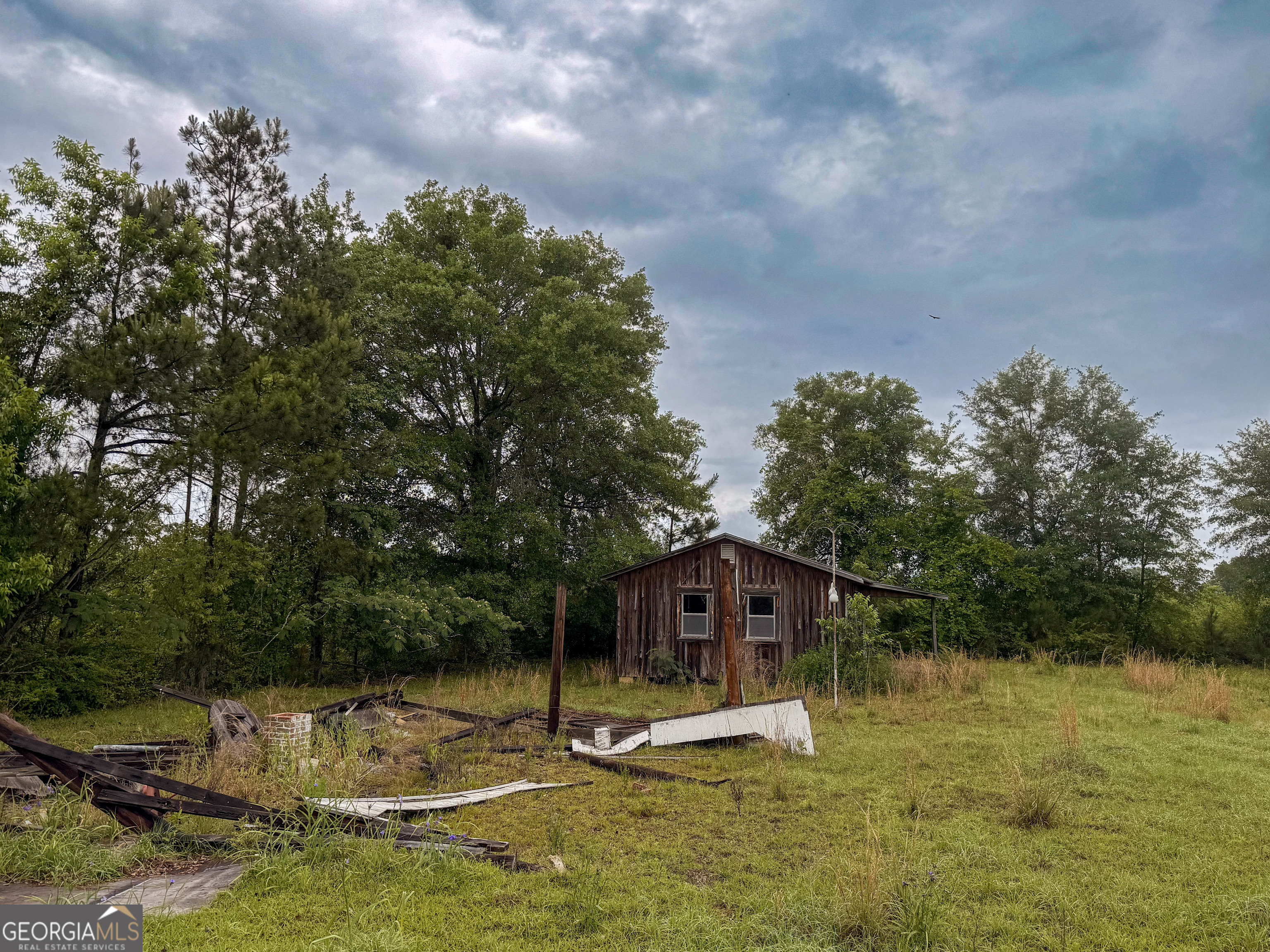 3925 Highway 441 Rentz, GA 31075 - Photo 4 of 16 a swimming pool with trees in the background