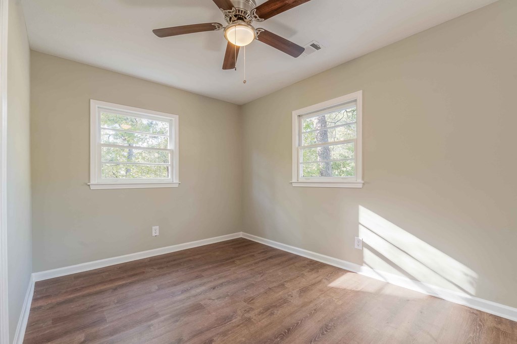4810 Toney Drive Columbus, GA 31903 - Photo 11 of 17 a view of an empty room with wooden floor and a window