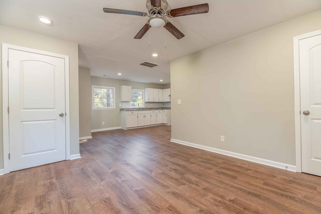 4810 Toney Drive Columbus, GA 31903 - Photo 5 of 17 wooden floor in an empty room with a window