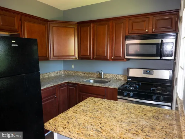 a kitchen with a stove and a microwave