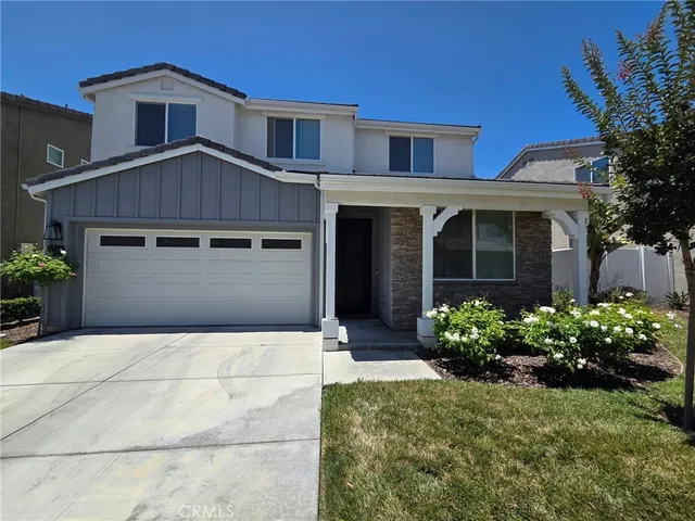 a house view with a garden space