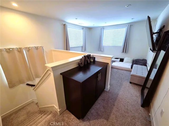 a living room with a couch and a flat screen tv