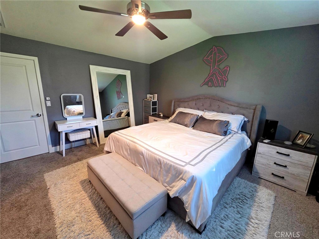 6741 Rhea Court Reseda, CA 91335 - Photo 12 of 18 a bedroom with a bed and a chandelier