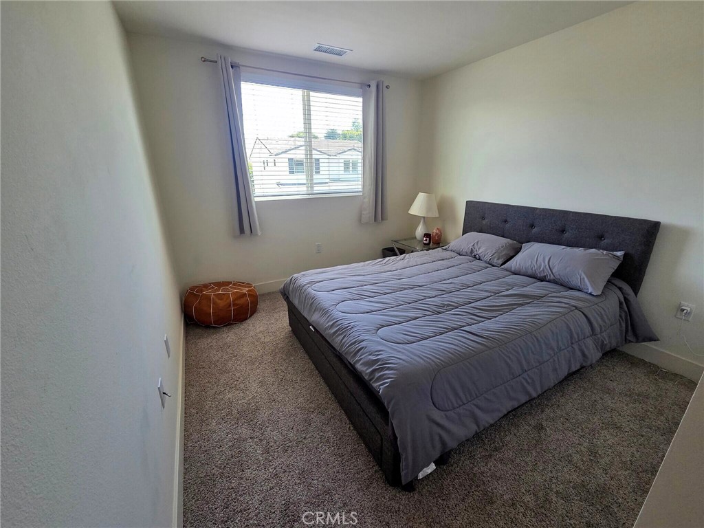 6741 Rhea Court Reseda, CA 91335 - Photo 14 of 18 a bedroom with a bed and window