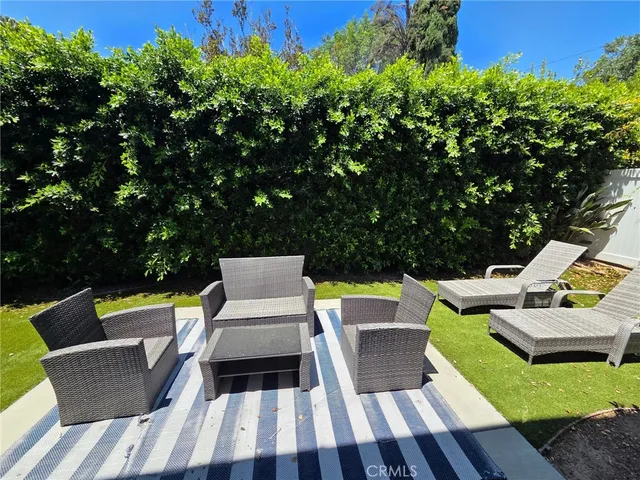 swimming view of sitting area with chairs