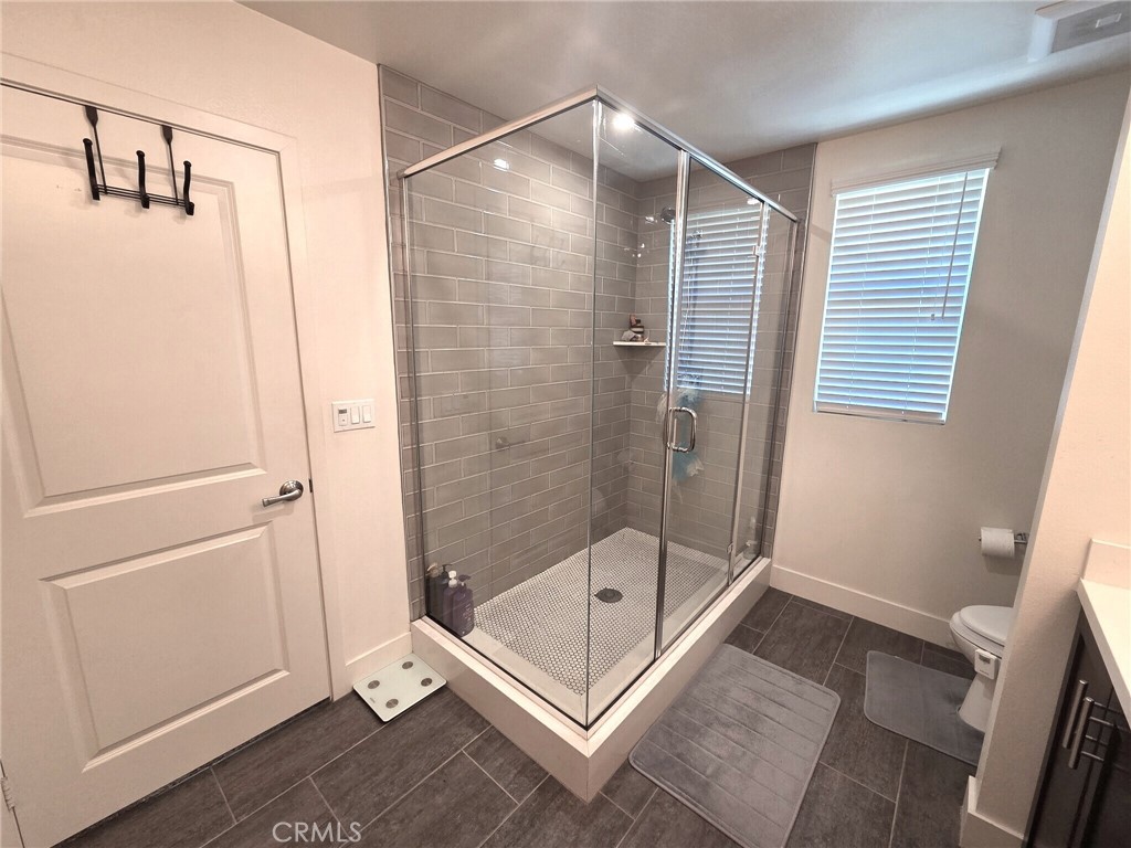 6741 Rhea Court Reseda, CA 91335 - Photo 8 of 18 a bathroom with a bath tub and a shower