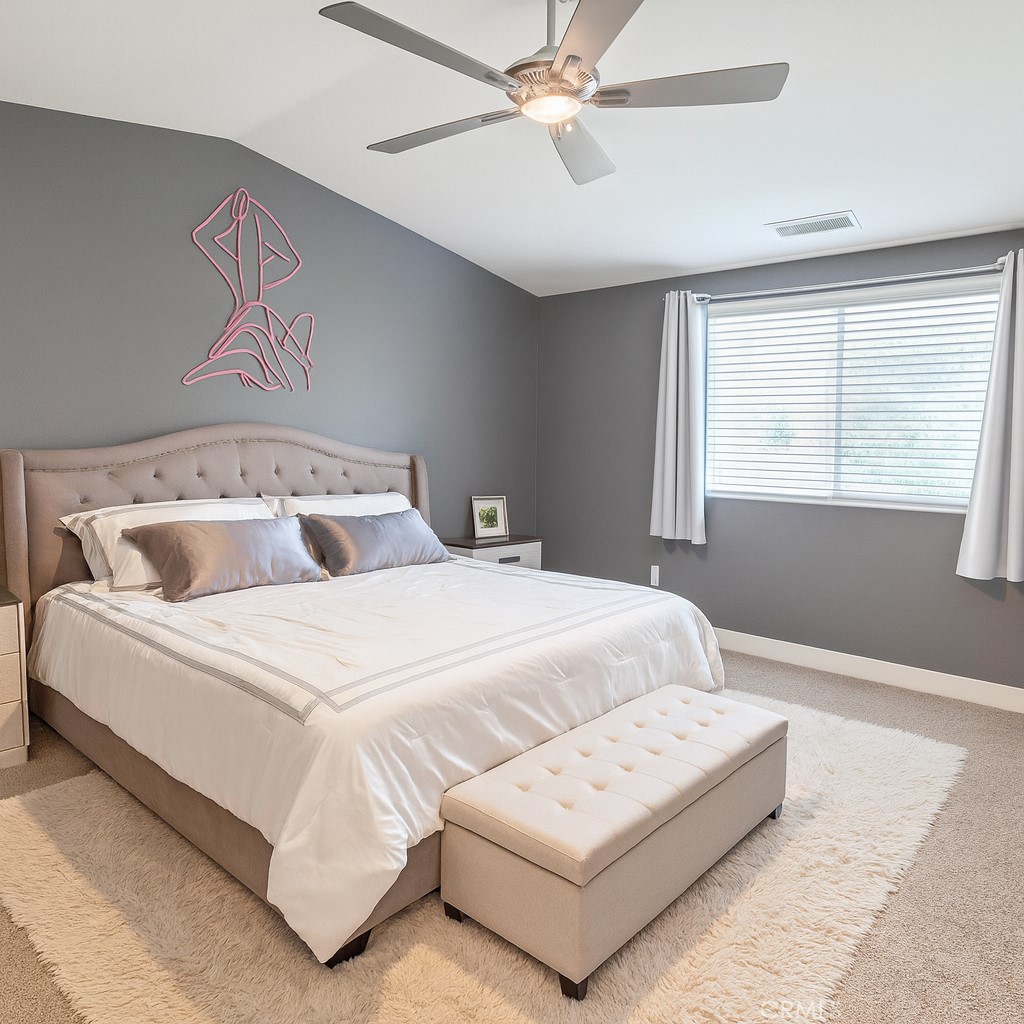 6741 Rhea Court Reseda, CA 91335 - Photo 10 of 18 a bedroom with a large bed and a window