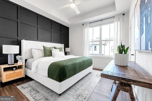 a living room with a bed furniture and a window