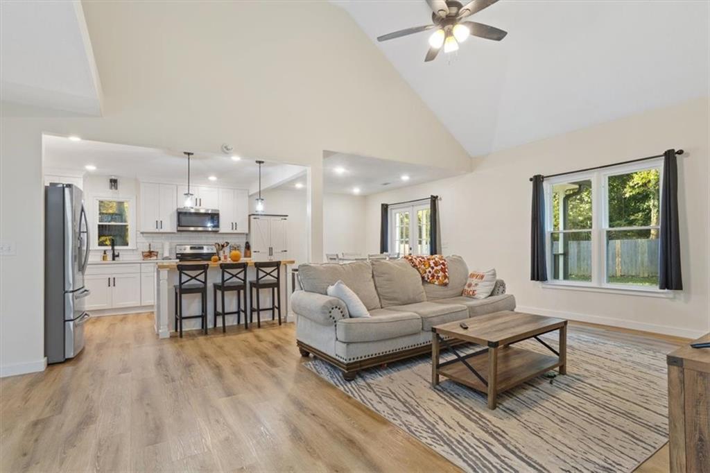 58 Quail Run Cartersville, GA 30120 - Photo 13 of 44 a living room with furniture and a kitchen view