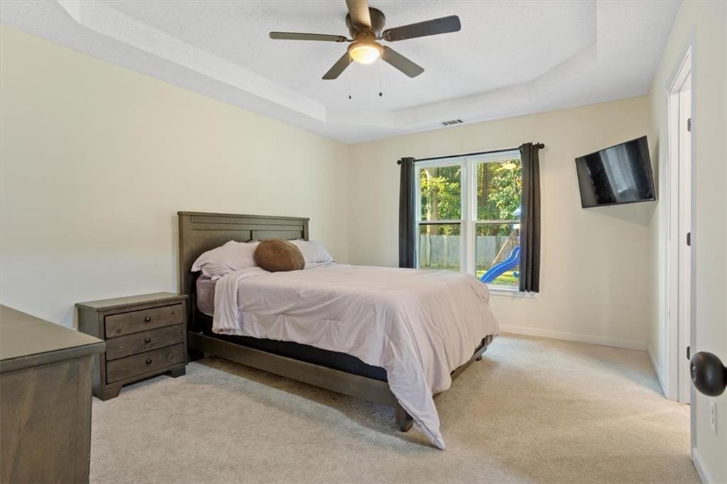 58 Quail Run Cartersville, GA 30120 - Photo 14 of 44 a bedroom with a bed and window