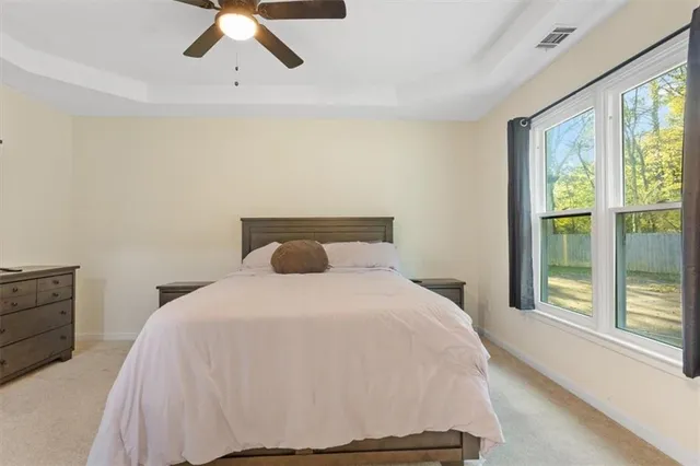 a bedroom with a bed and window