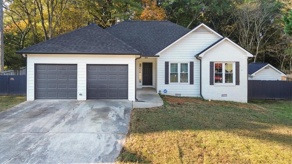 58 Quail Run Cartersville, GA 30120 - Photo 2 of 44 a front view of a house with a yard and garage