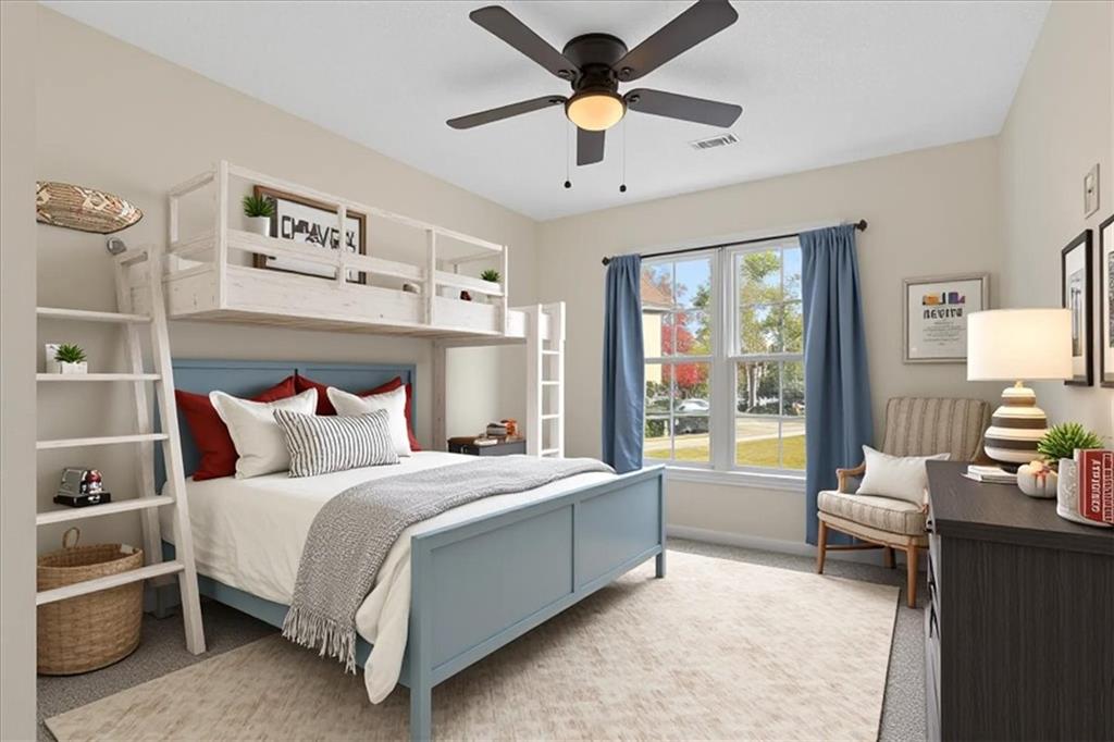 58 Quail Run Cartersville, GA 30120 - Photo 21 of 44 a bedroom with a large bed and a chandelier fan