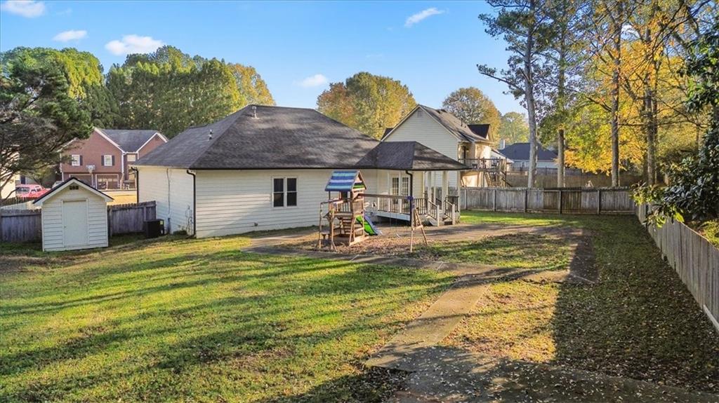 58 Quail Run Cartersville, GA 30120 - Photo 41 of 44 a house view with swimming pool and trees in the background