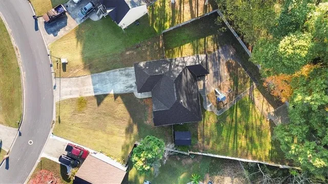 an aerial view of houses with yard