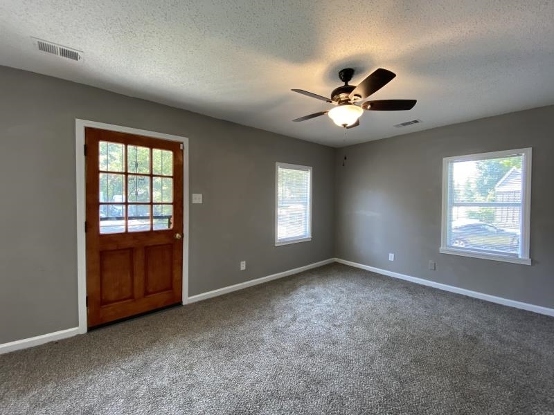 2119 Pendleton Street Memphis, TN 38114 - Photo 2 of 8 a view of an empty room with a window