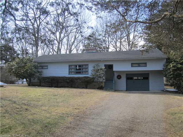 153 Scott Road Prospect, CT 06712 - Photo 1 of 1 a front view of a house with a yard and garage