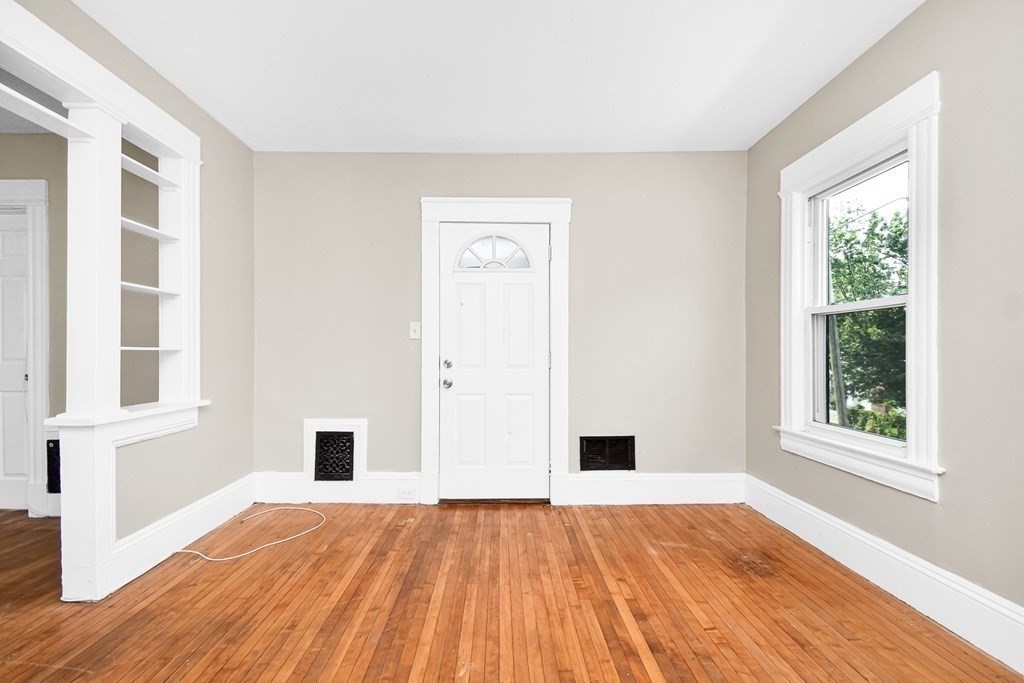 335 Oakland Street Springfield, MA 01108 - Photo 12 of 42 a view of empty room with wooden floor and fan