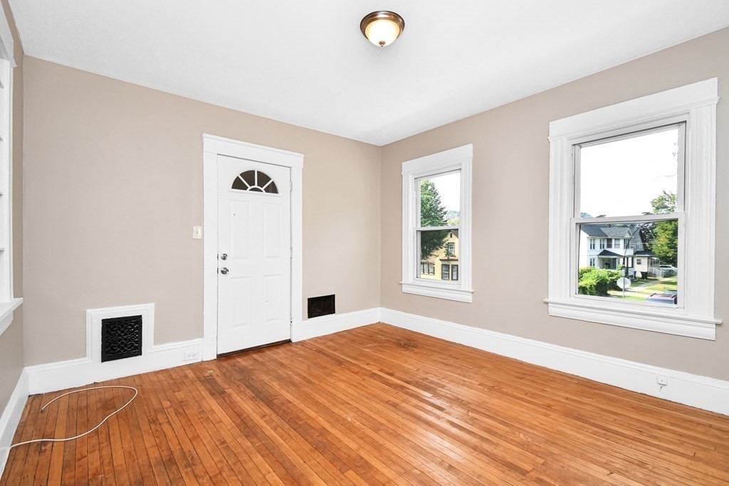 335 Oakland Street Springfield, MA 01108 - Photo 13 of 42 a bedroom with a bed and a window