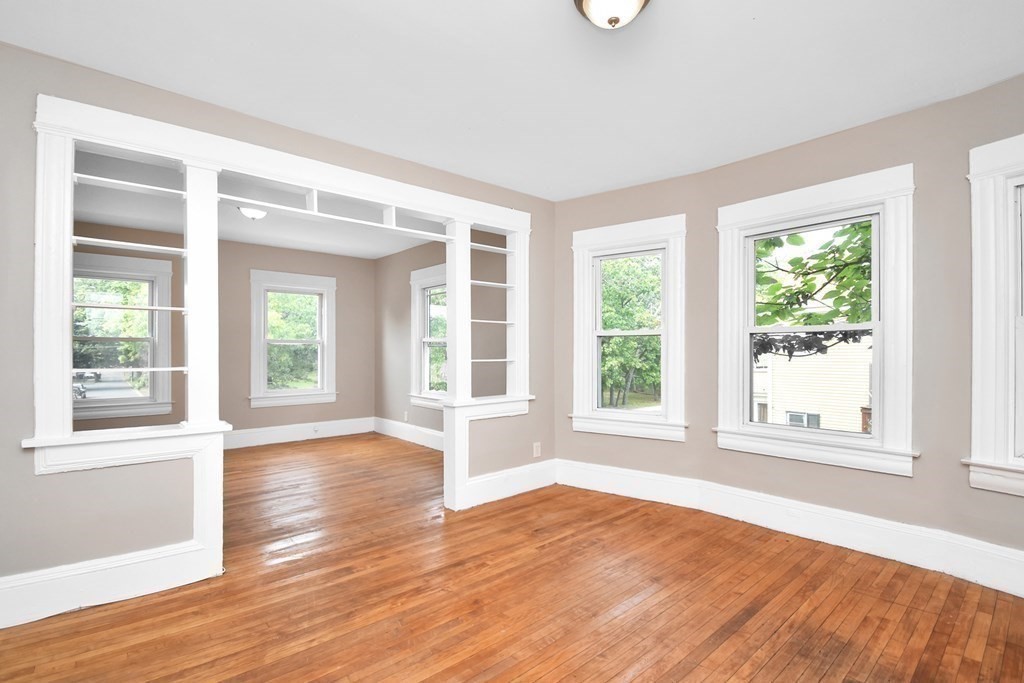 335 Oakland Street Springfield, MA 01108 - Photo 16 of 42 a view of empty room with wooden floor and fan