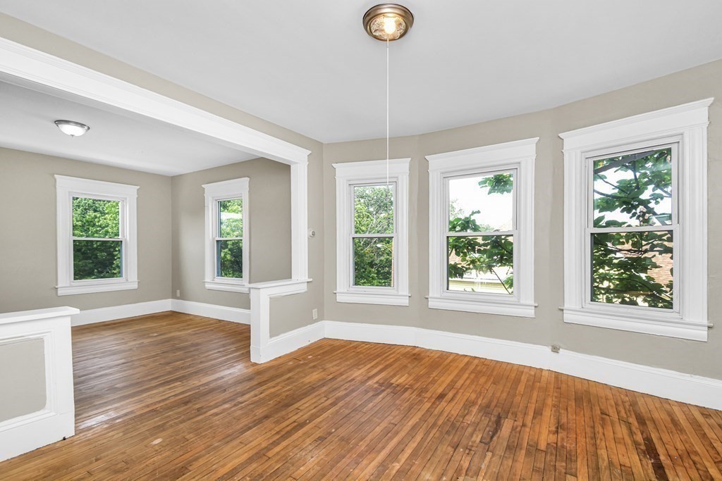 335 Oakland Street Springfield, MA 01108 - Photo 36 of 42 a view of empty room with wooden floor and fan