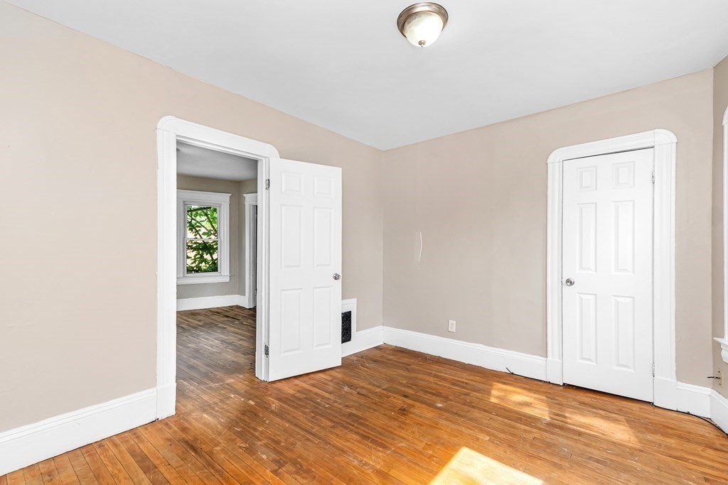 335 Oakland Street Springfield, MA 01108 - Photo 39 of 42 a view of empty room with wooden floor